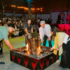 Khai lửa một trong những nghi thức trước khi bắt đầu chương trình giao lưu cồng chiêng trong tour du lịch cho học sinh cấp 3 tại chân núi Langbiang